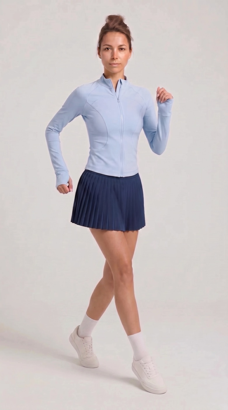 Zip jacket in ice blue with navy pleated skirt